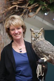 Dr. Julia Ponder with a great horned owl ambassador